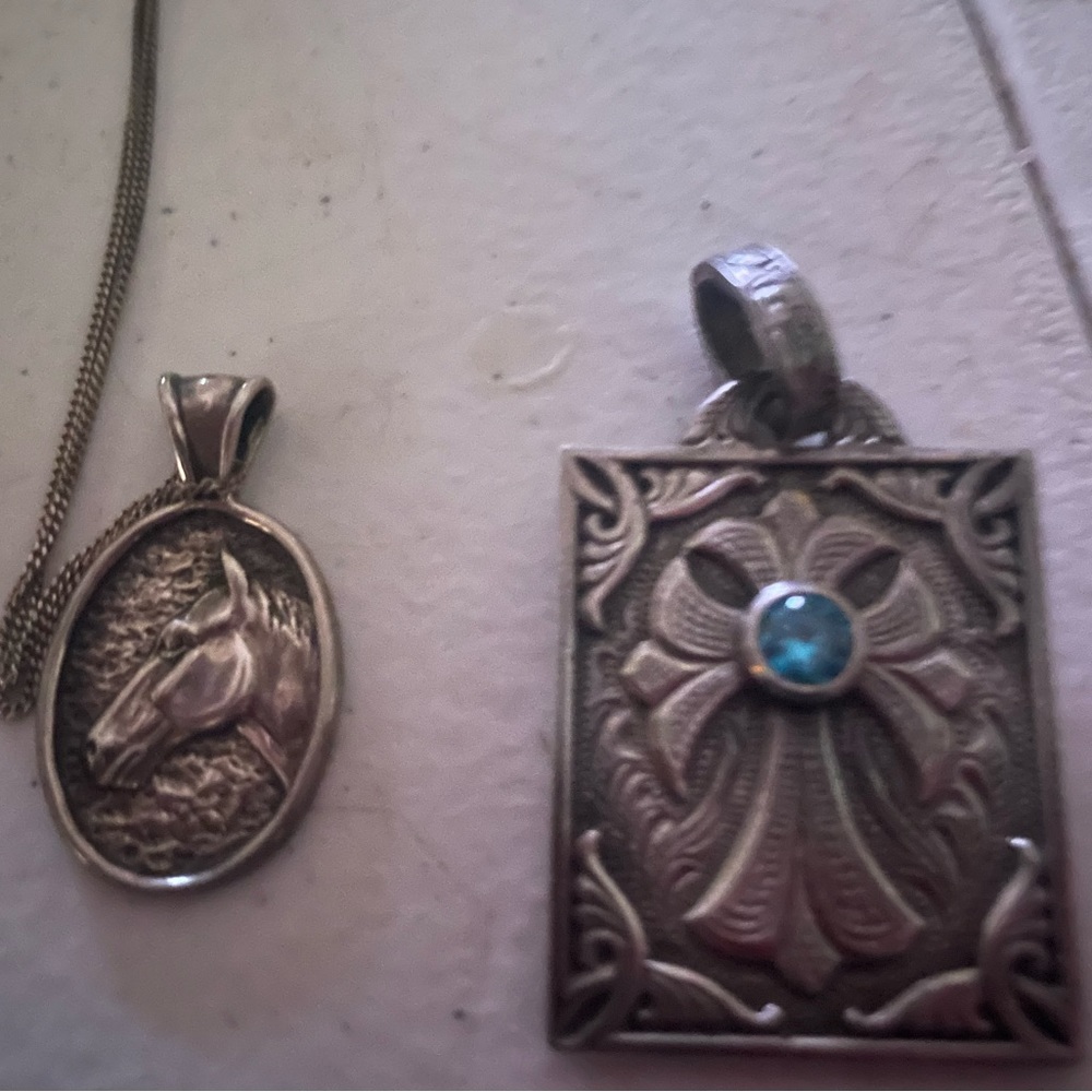 Sterling silver w/ chain horse.  Sterling  silver Rockin Out cross Pendant.